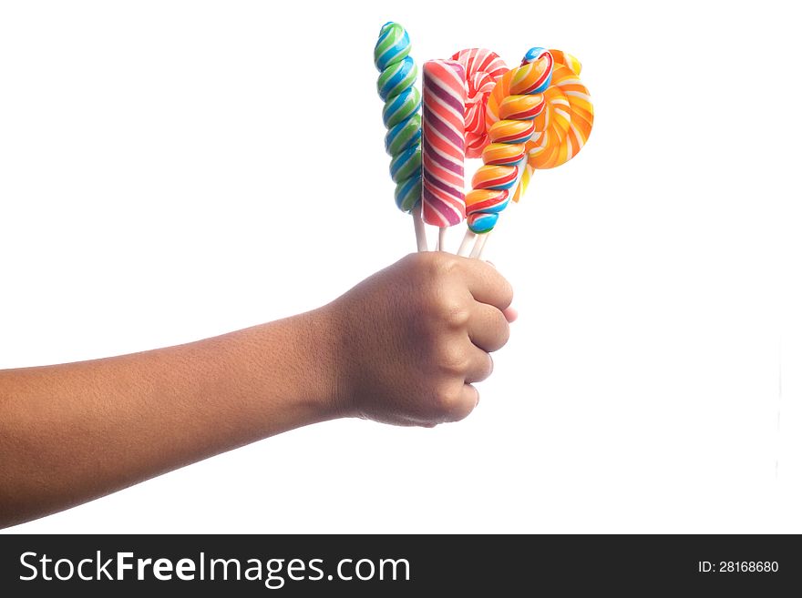 Child's hands holding candy isolated on white. Child's hands holding candy isolated on white