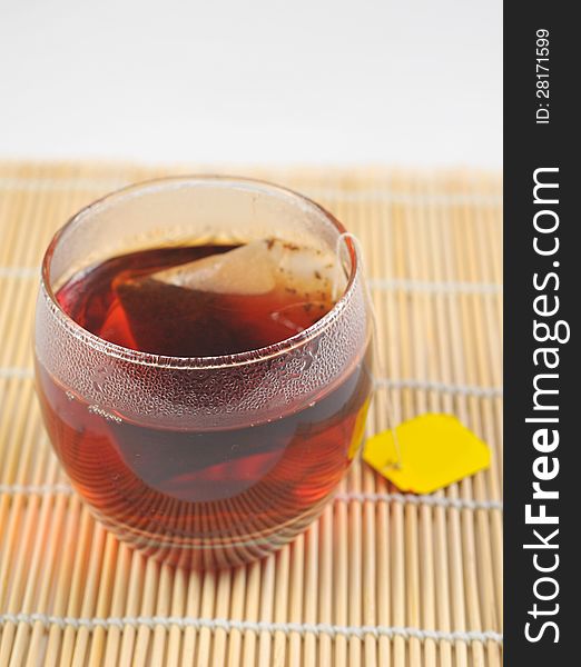 A cup of black tea on the white background