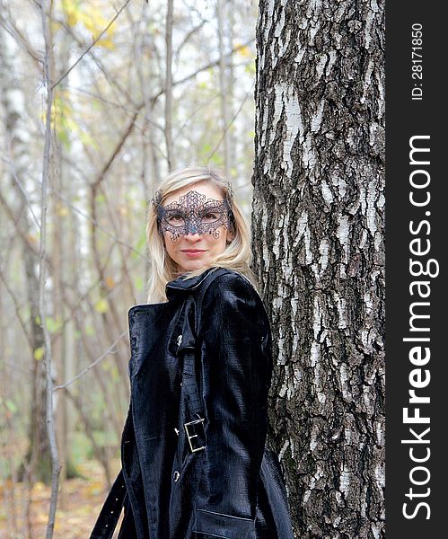 Lovely middle-aged woman in a carnival half-mask