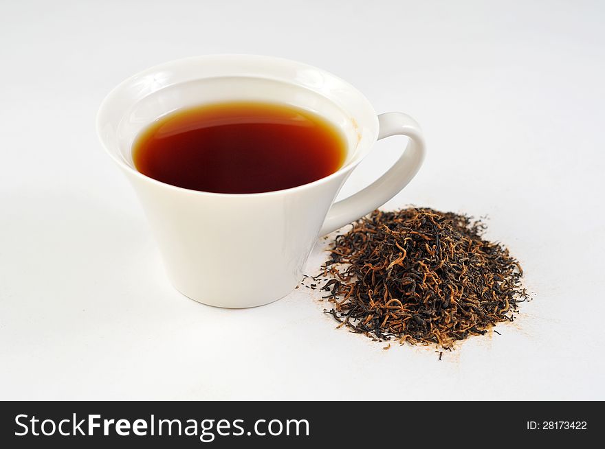 A cup of black tea on the white background