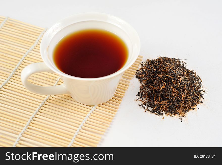 A cup of black tea on the white background