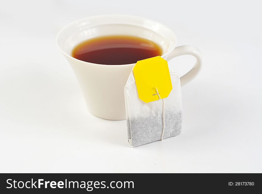 A cup of black tea on the white background