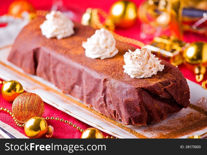 Photograph of a fancy frozen chocolate cake for christmas. Photograph of a fancy frozen chocolate cake for christmas