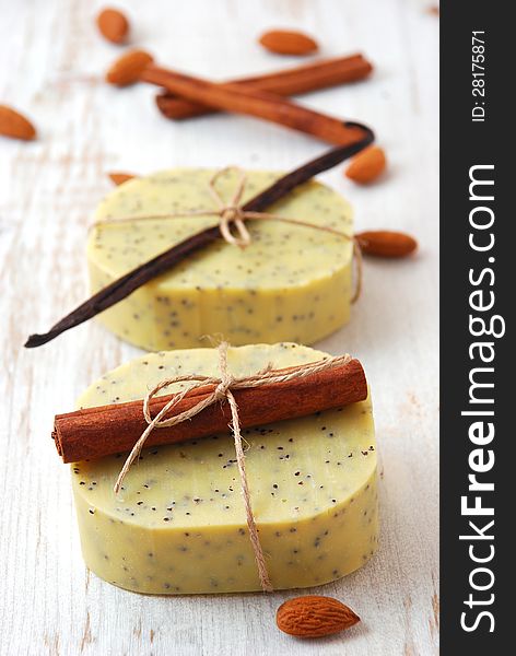 Olive soap with ingredients on a white table