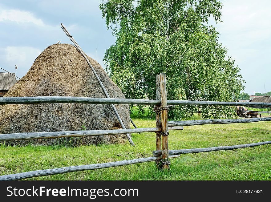 Haystack and birch tree in the village of summer. Haystack and birch tree in the village of summer.