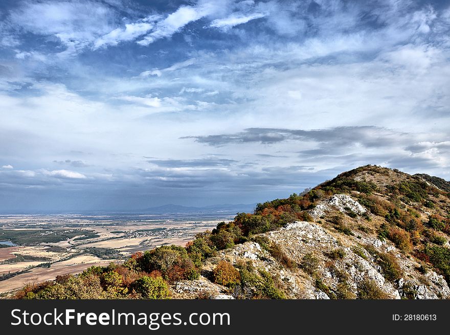 Mountain ridge against the sky with clouds