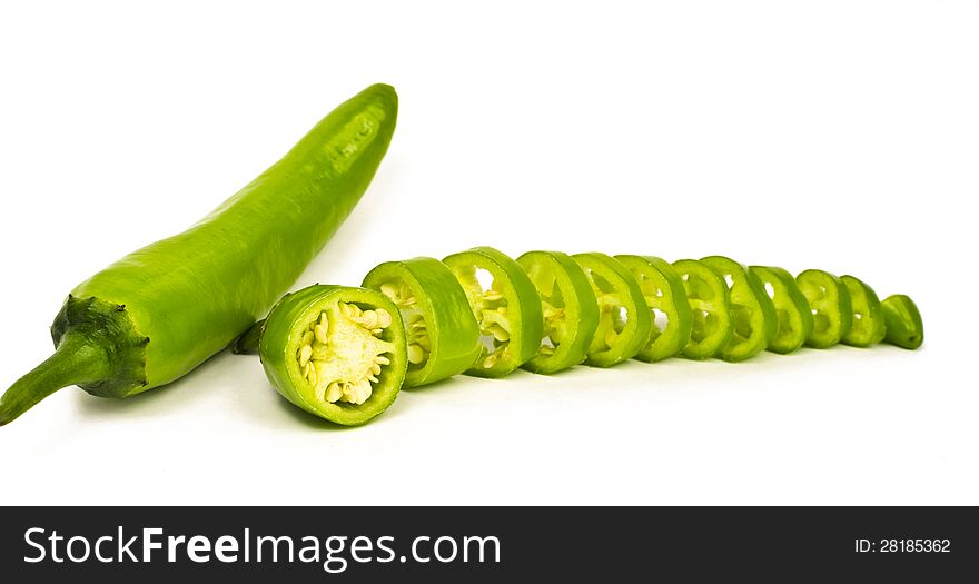 Hot green Jalapeno sliced and whole kept on white background. Hot green Jalapeno sliced and whole kept on white background.