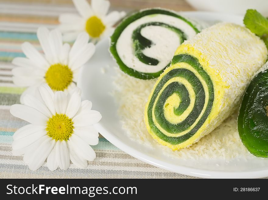 Sweet dessert with flower in a plate, closeup
