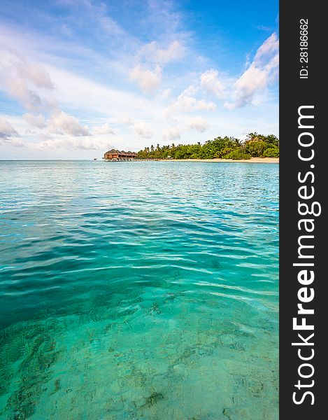 Landscape of the ocean and tropical island with blue sky