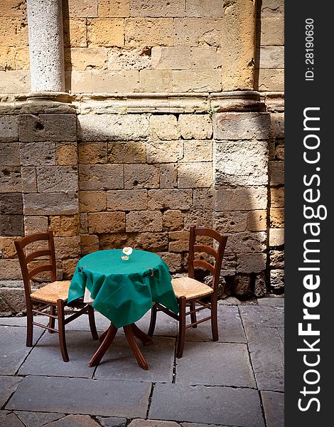 Table for two near ancient wall. Table for two near ancient wall