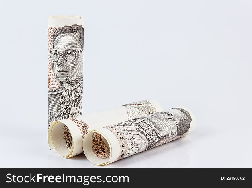 Roll of thai banknotes isolated on white background