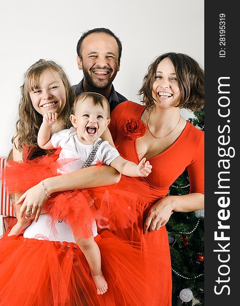 Happy Christmas family in a studio