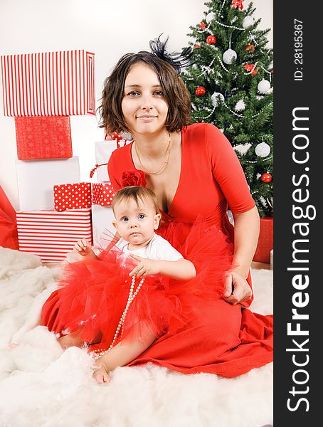 Happy Mother with her daughter in a studio. Christmas time. Happy Mother with her daughter in a studio. Christmas time