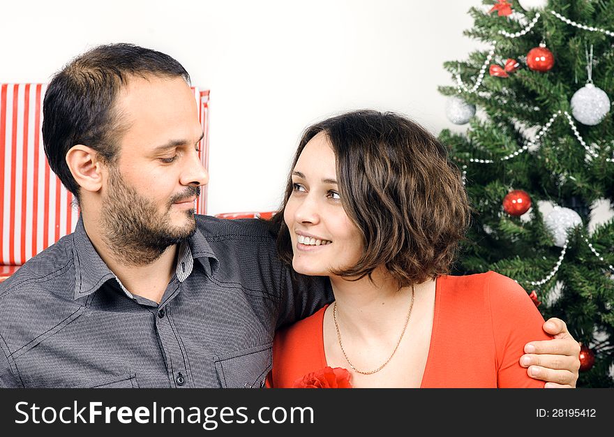 Happy Christmas couple in a studio