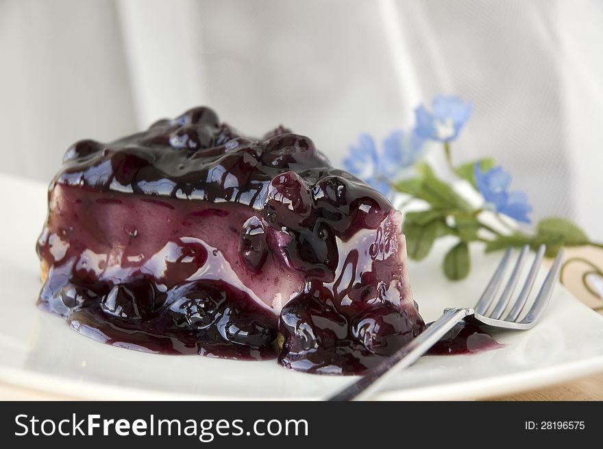 Close up blueberry topping on cheesecake