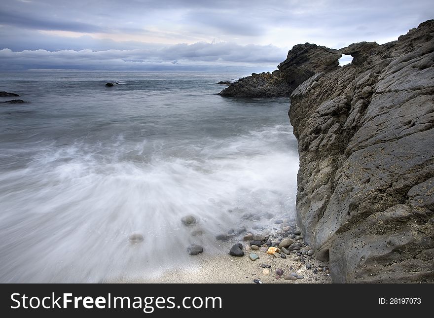 Exposure of a coastal tide surging through a cove. Exposure of a coastal tide surging through a cove.