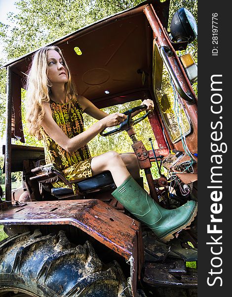 Farmer Woman Working on Tractor