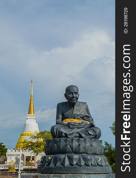 Statue of a famous monk in front of a holy pagoda, Songkhla