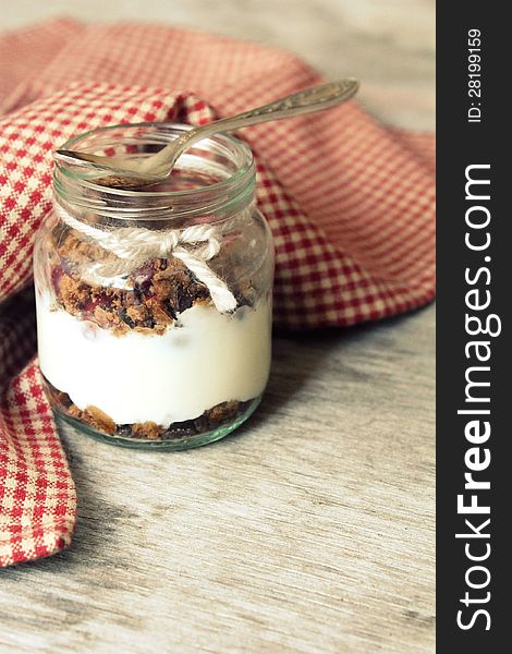 Cream cheese dessert with chocolate, cookies and cherry in a jar. Cream cheese dessert with chocolate, cookies and cherry in a jar