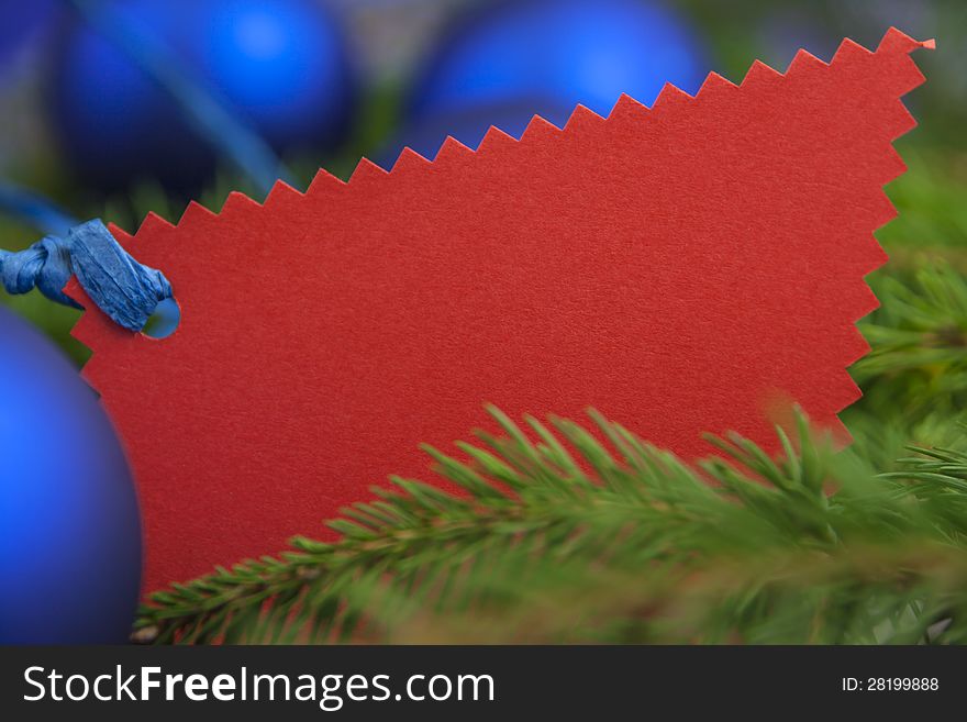 Christmas card with blue balls spruce twig