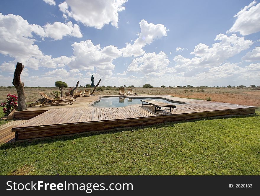 Luxury pool with sunbeds on the middle of the desert. Luxury pool with sunbeds on the middle of the desert