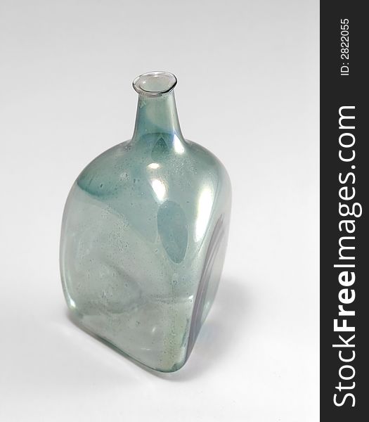 Ancient glass bottle isolated on gray. Ancient glass bottle isolated on gray