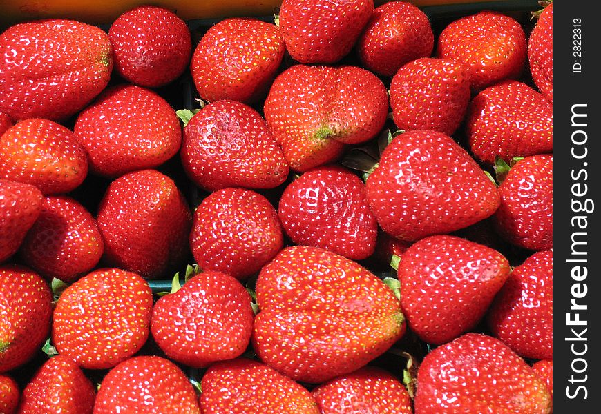 Fresh strawberries at a local market. Fresh strawberries at a local market.