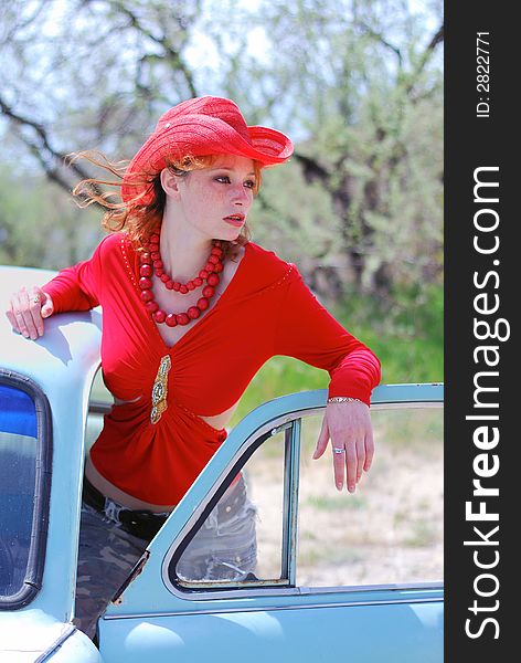 The girl in red and old car