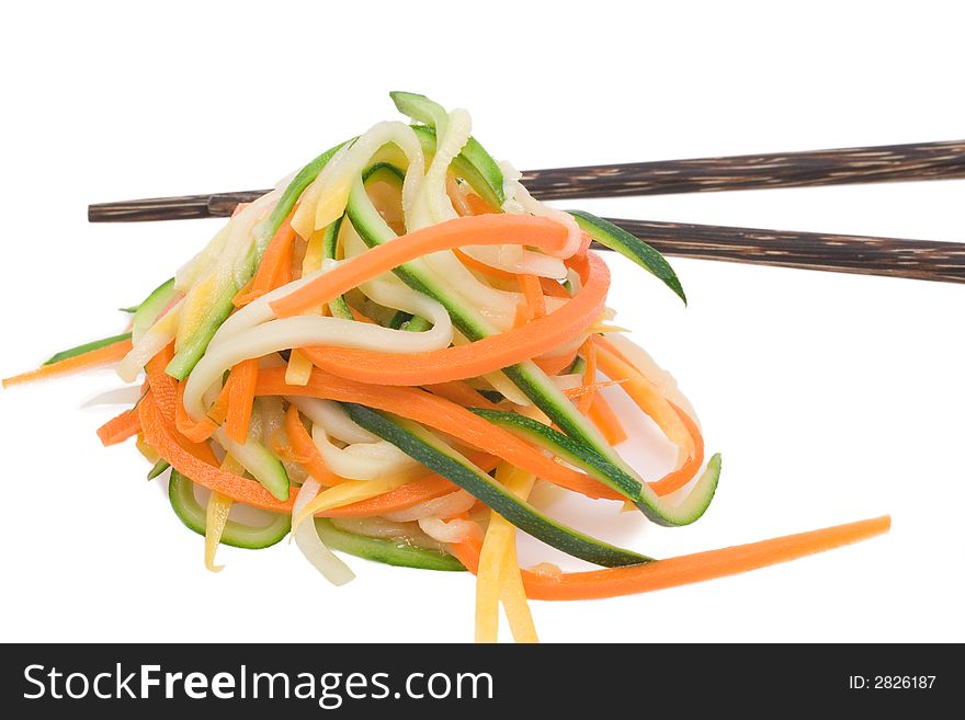 Carrot, zucchini and yellow summer squash spaghetti with chop sticks. Carrot, zucchini and yellow summer squash spaghetti with chop sticks