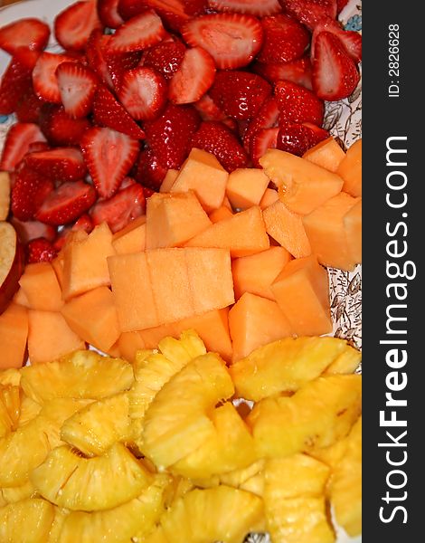 A colorful tray full of fresh cut fruit. A colorful tray full of fresh cut fruit