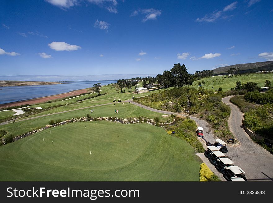 African golf course, green blue, sunny