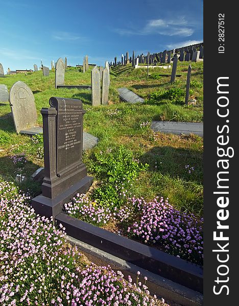 Aberdaron cemetery graves with flowers, Wales