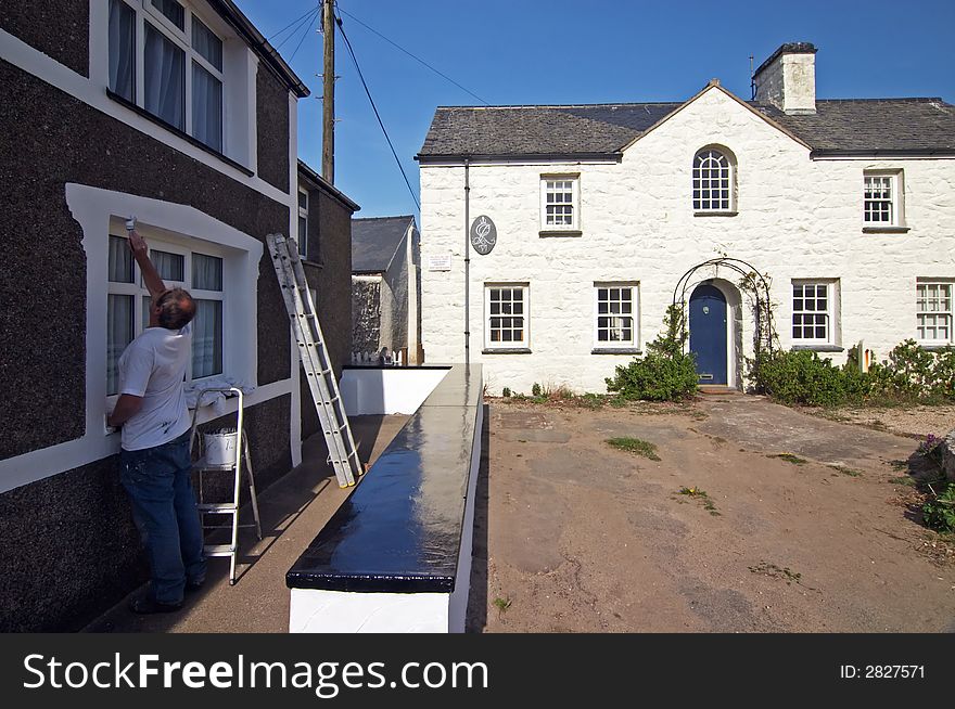 Painter at work, welsh town