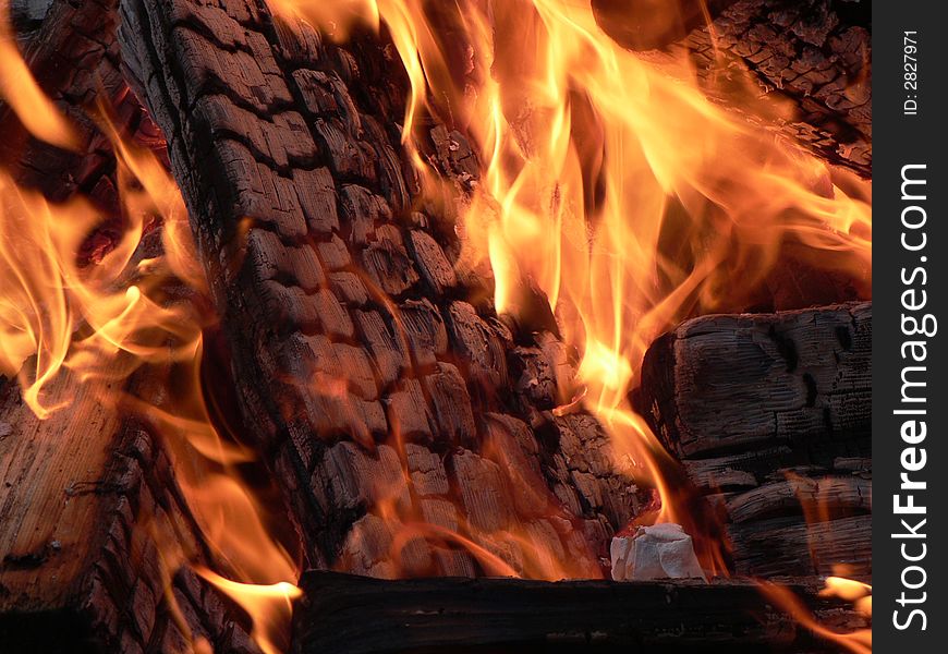 A macro shot of burning wood. A macro shot of burning wood