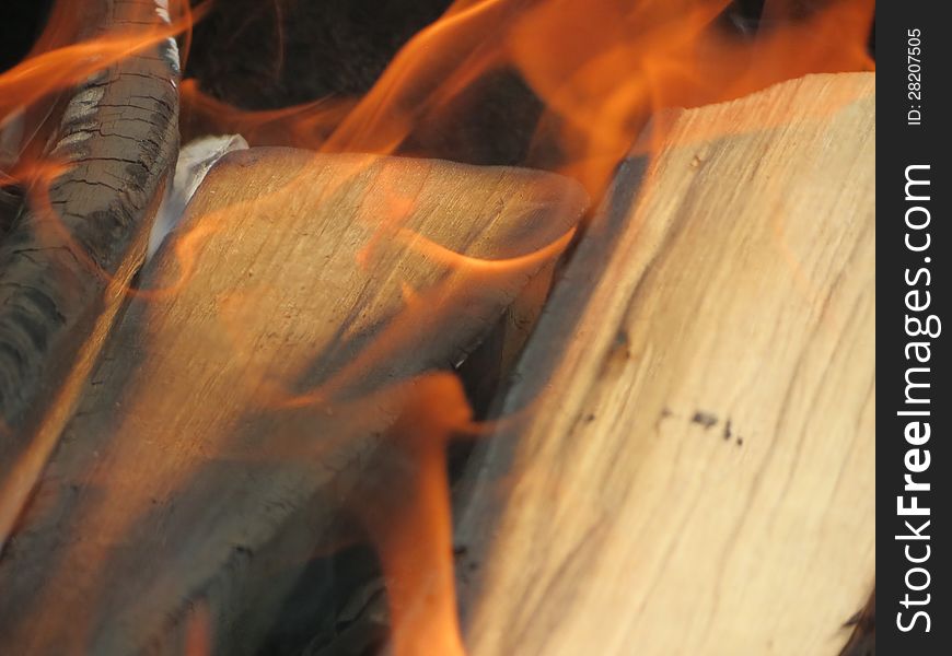 Burning of wood, begins to burn
