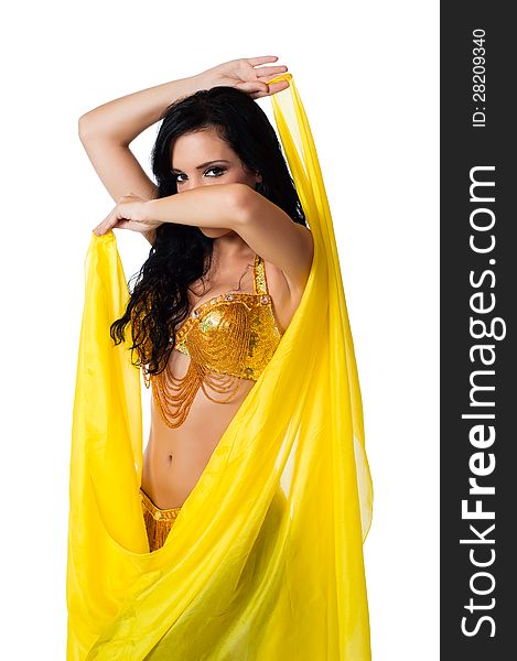 Exotic belly dancer wearing a gold costume and posing with a bright yellow silk veil. Isolated on white. Clipping path included. Exotic belly dancer wearing a gold costume and posing with a bright yellow silk veil. Isolated on white. Clipping path included.