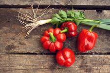 Red Pepper And Green Onions On A Table Royalty Free Stock Photos Red Pepper And Green Onions On A Table Royalty Free Stock Photos