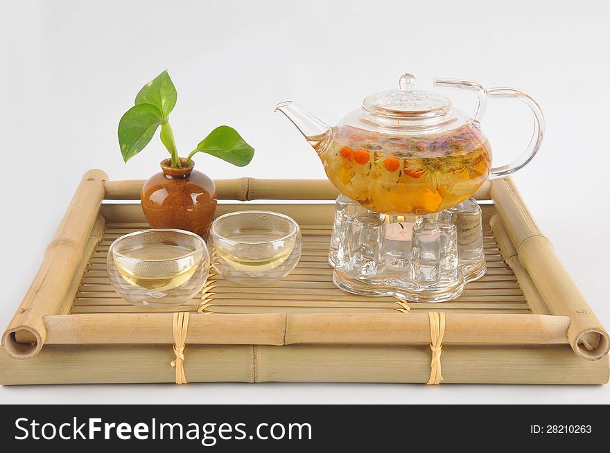 A glass Tea making set on a bamboo background