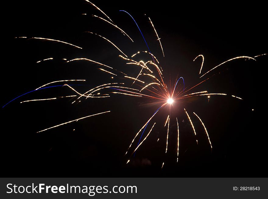 Red and blue fireworks on the black sky background