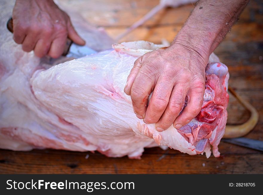 Pork cutted by a butcher on a wooden table