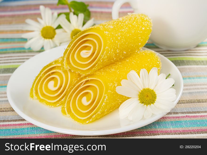 Yellow Candy on a plate, closeup
