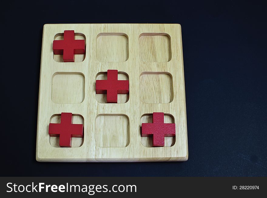 Red cross on wood board