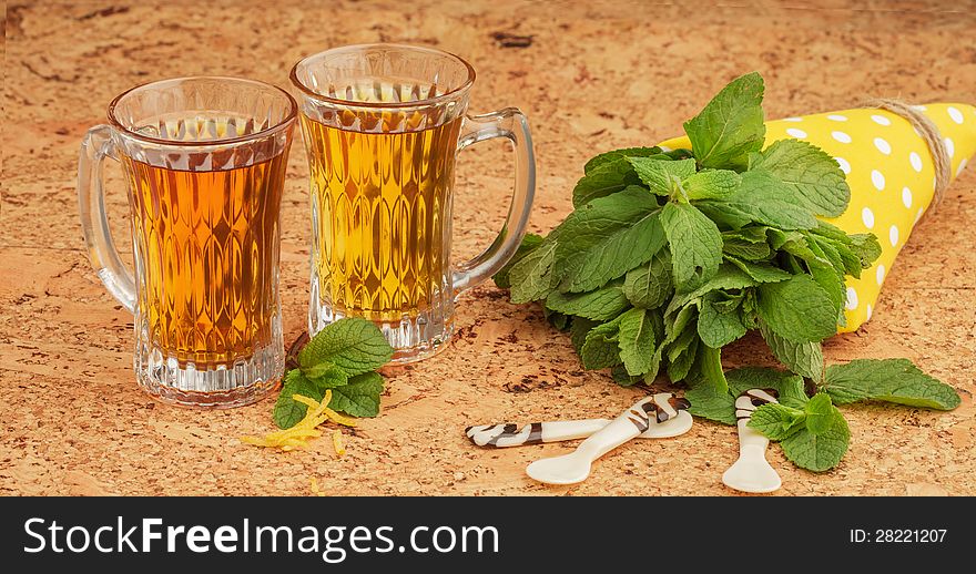 Delicious mint tea with citron, on a cork table