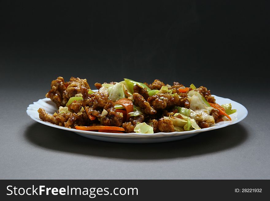 Dry crispy beef in soy sauce and vegetables