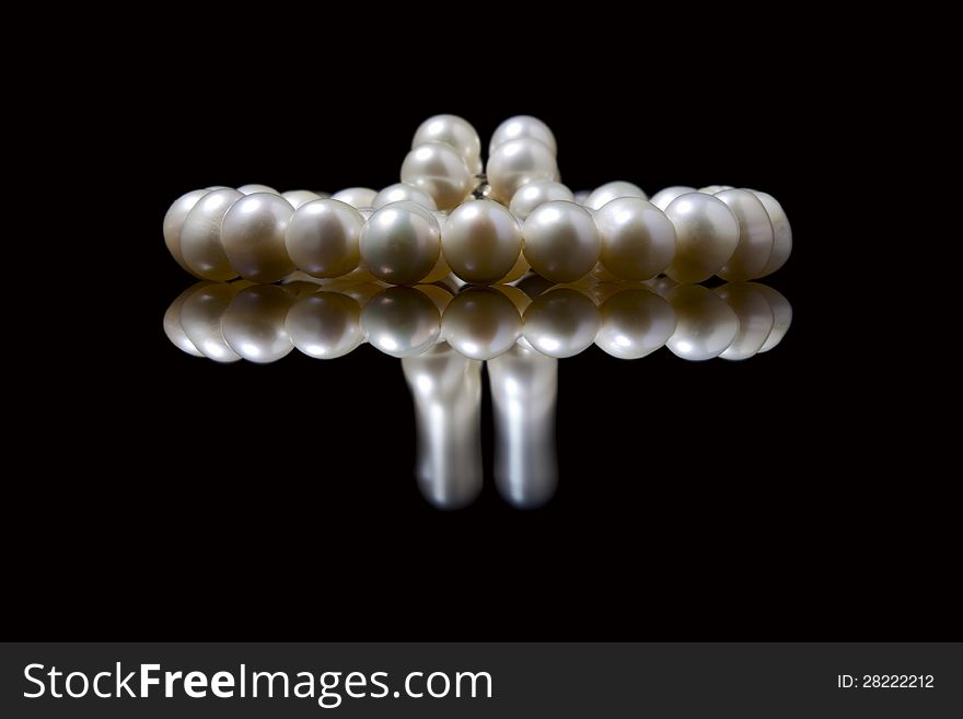 Composition of pearls close-up on black background. Composition of pearls close-up on black background