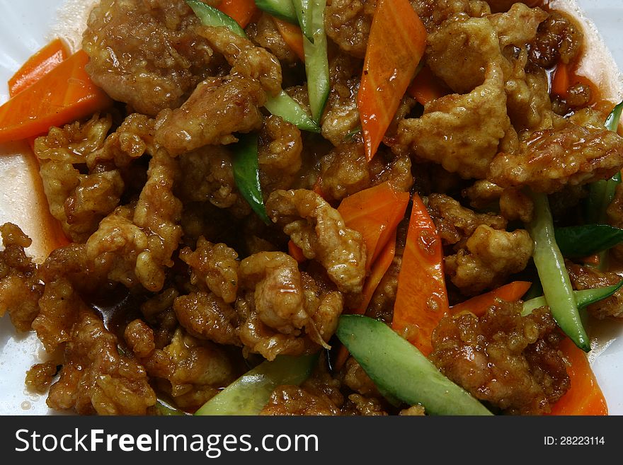Dry crispy beef in soy sauce and vegetables