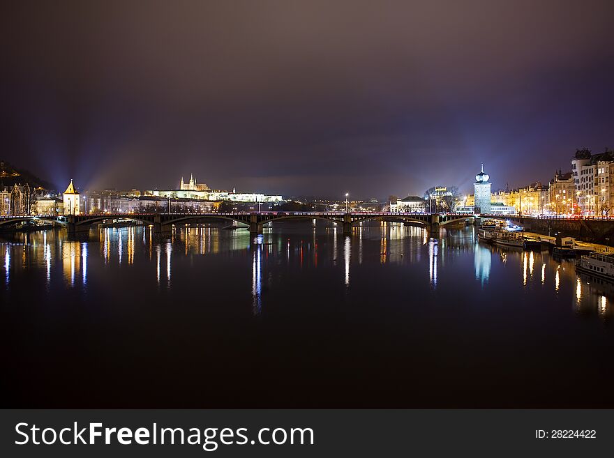 Prague castle, Zofin and Kampa illuminated at night over Vltava River. Prague castle, Zofin and Kampa illuminated at night over Vltava River.