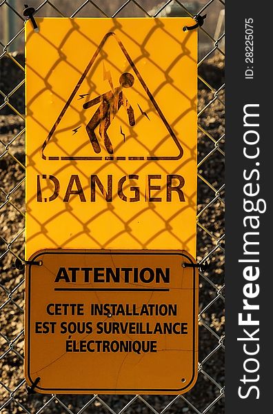 Danger sign attach to a fence arounf a electrical power plan