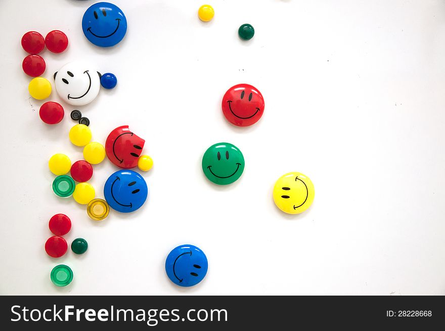 Many colourful smiling faces magnet