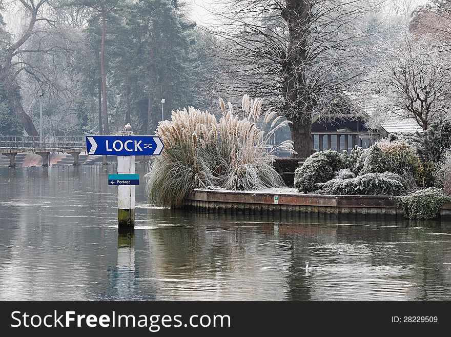 Winter on the River Thames in England with frost covered trees and plants. Winter on the River Thames in England with frost covered trees and plants